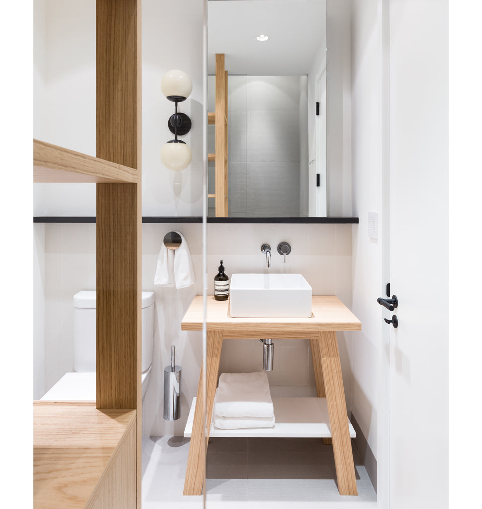 Sconce - 2 Globes (Black/Cream) — Vancouver, BC. Interior by Falken Reynolds. Image by Ema Peter